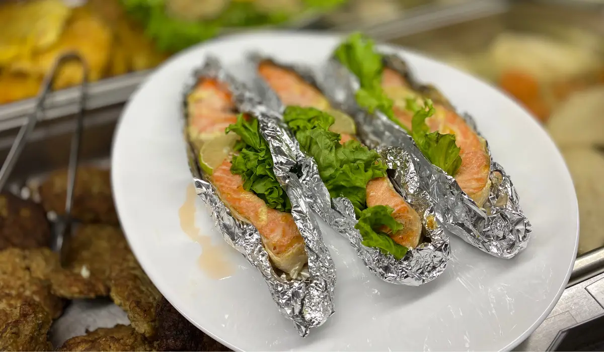A delectable plate highlighting Baking Salmon in Foil, paired with crisp lettuce - a perfect blend of health and flavor.