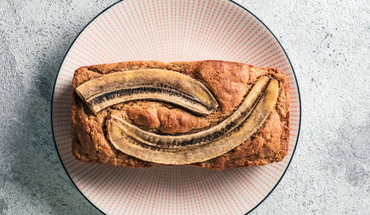 Enjoy a slice of our perfectly baked Banana Bread Without Baking Soda, deliciously presented on a plate, showcasing its fluffy texture and irresistible taste.