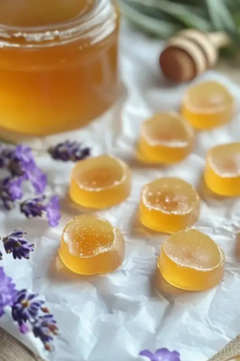 Homemade honey and herbal tea bombs for flu and cold relief on parchment paper.