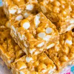 Stack of No Bake Butterscotch Marshmallow Bars filled with white chocolate chips and mini marshmallows.